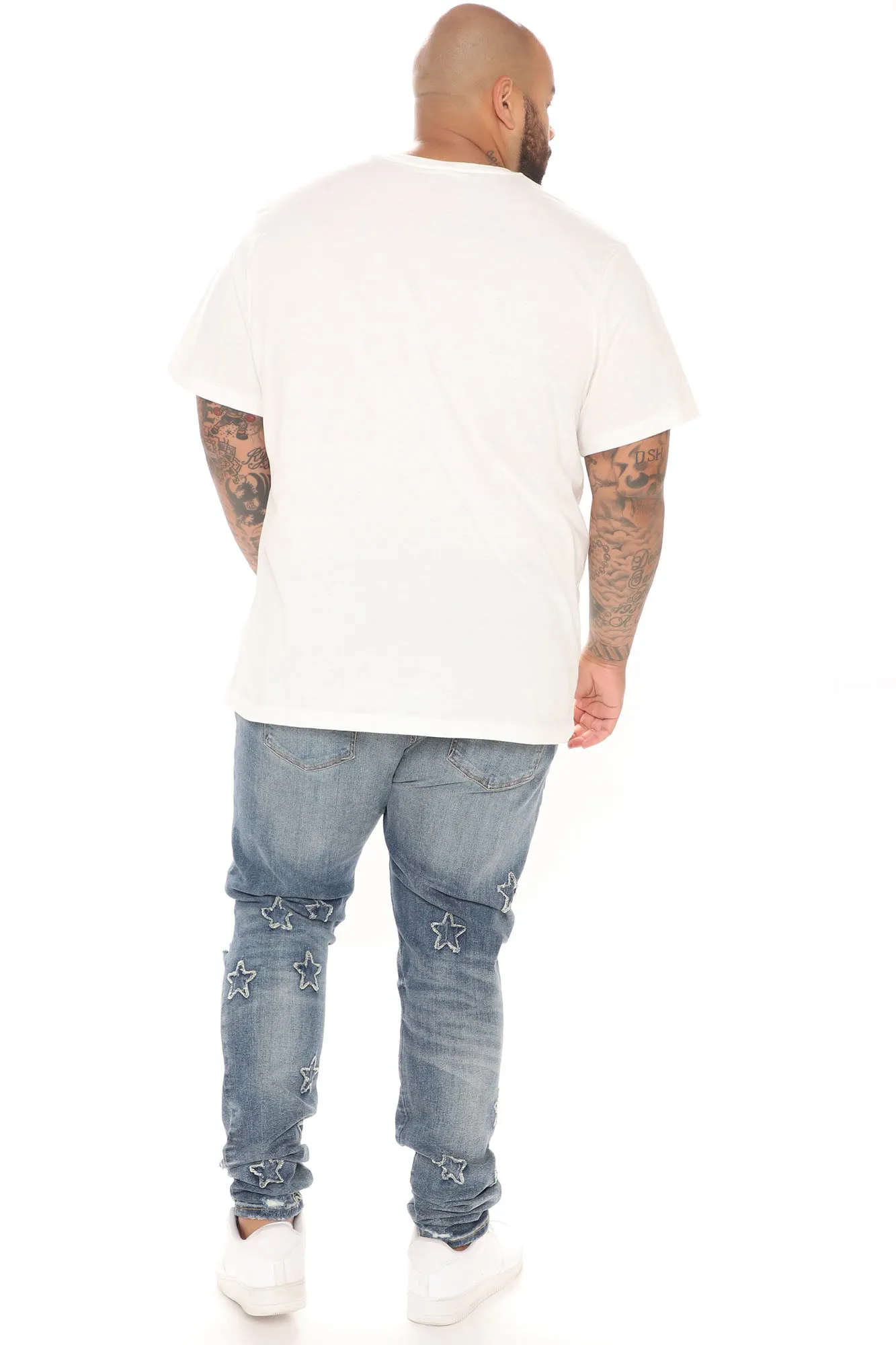 All Over Stars Ripped Stacked Skinny Jeans - Medium Wash