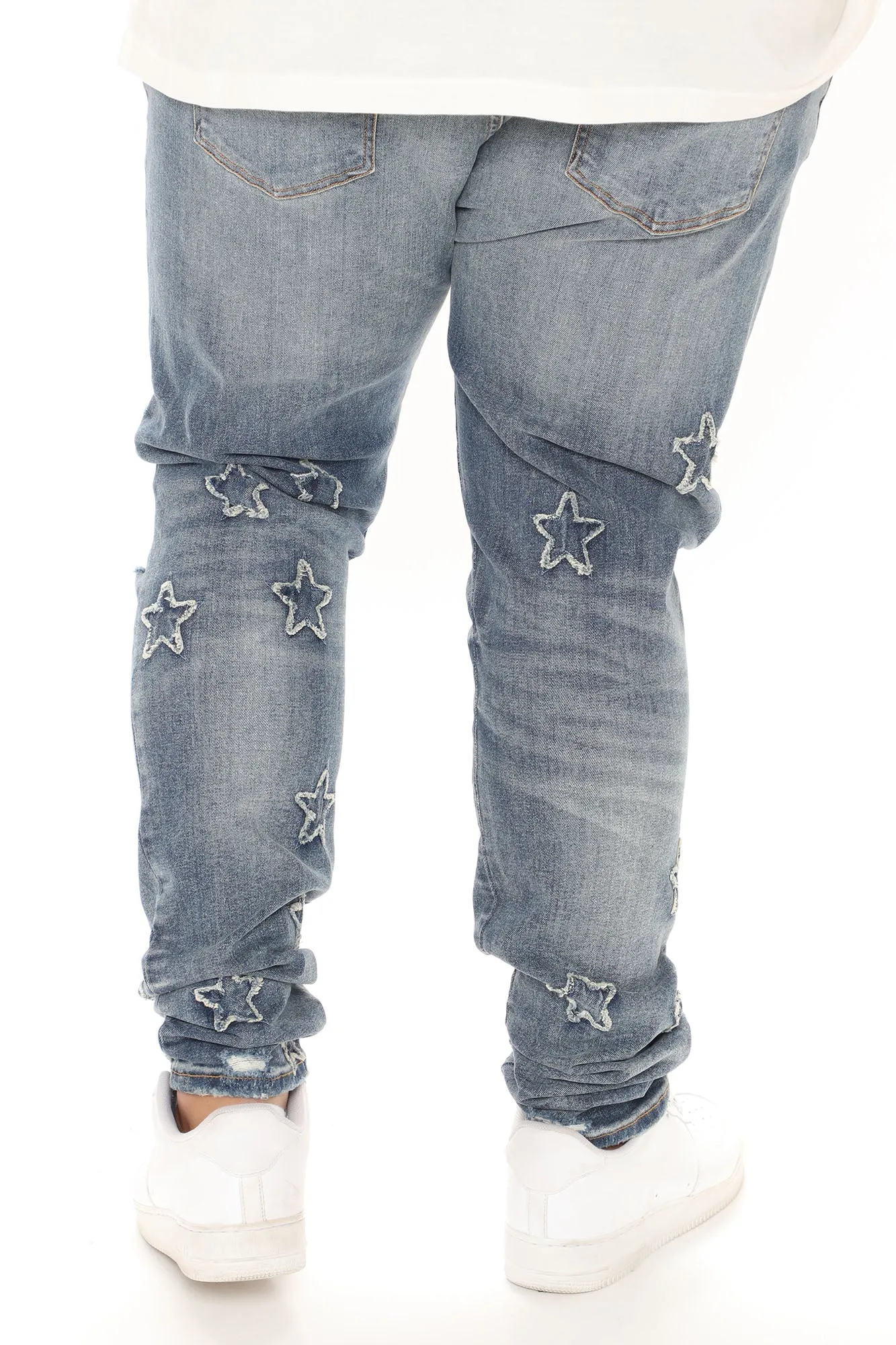 All Over Stars Ripped Stacked Skinny Jeans - Medium Wash