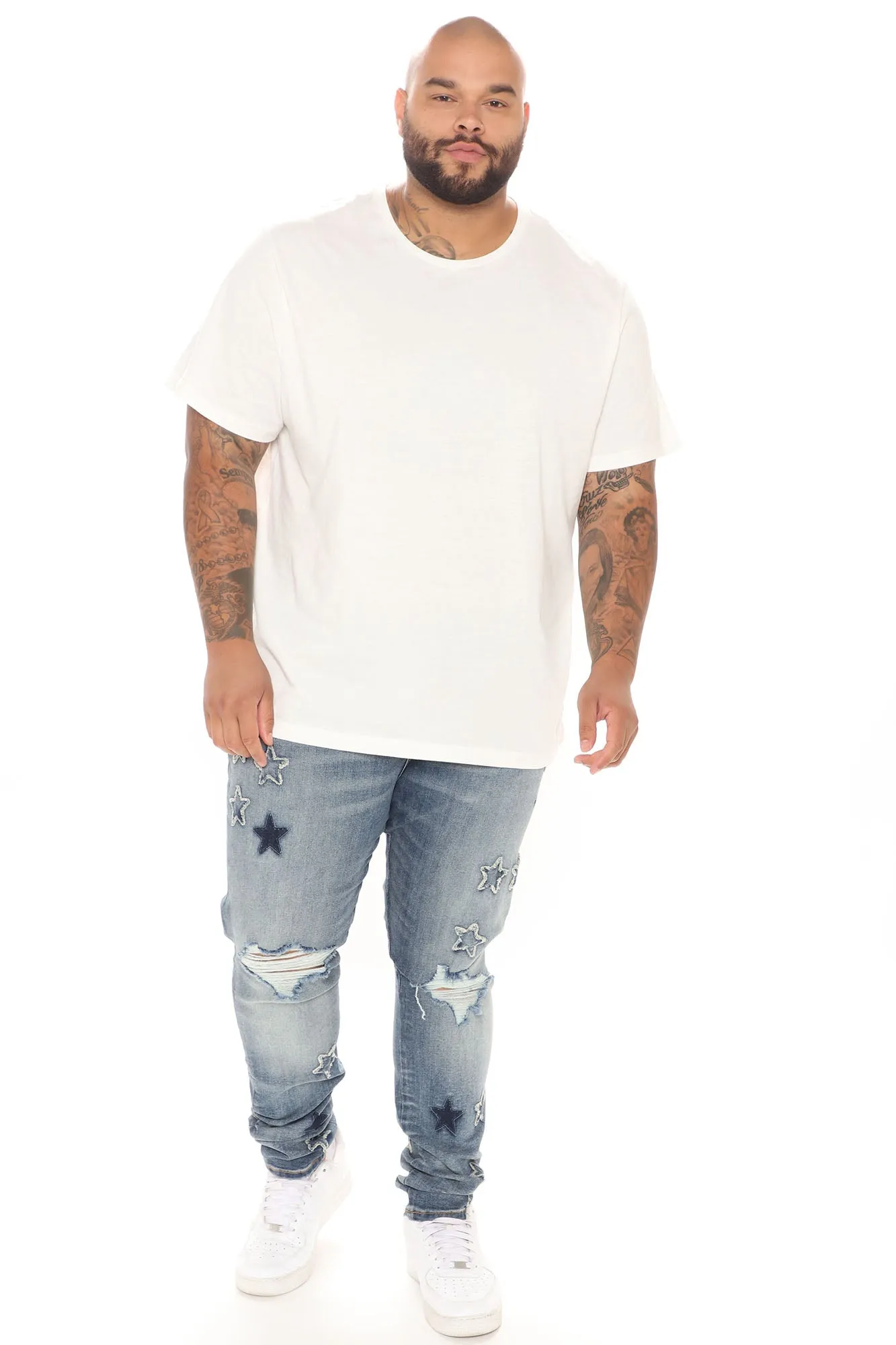 All Over Stars Ripped Stacked Skinny Jeans - Medium Wash