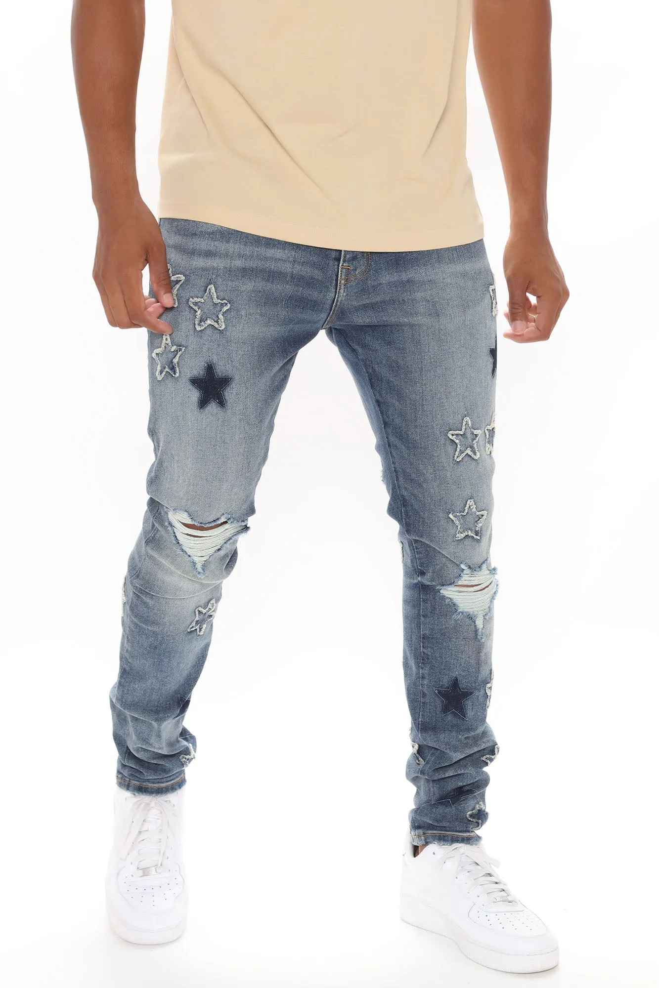 All Over Stars Ripped Stacked Skinny Jeans - Medium Wash